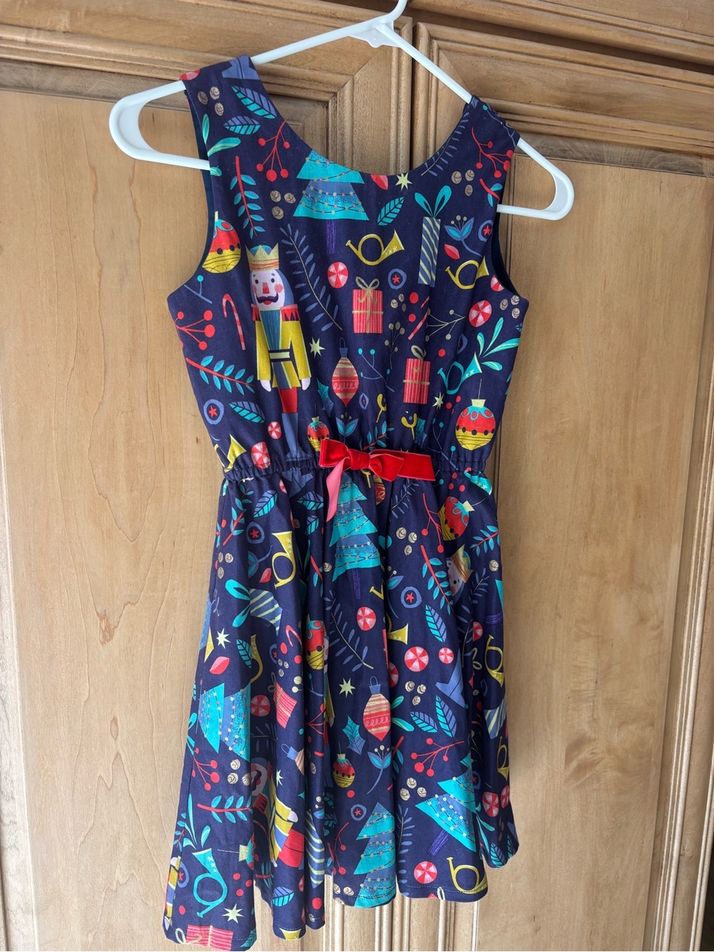 Girls Navy Holiday Nutcracker Print Dress with Red Bow